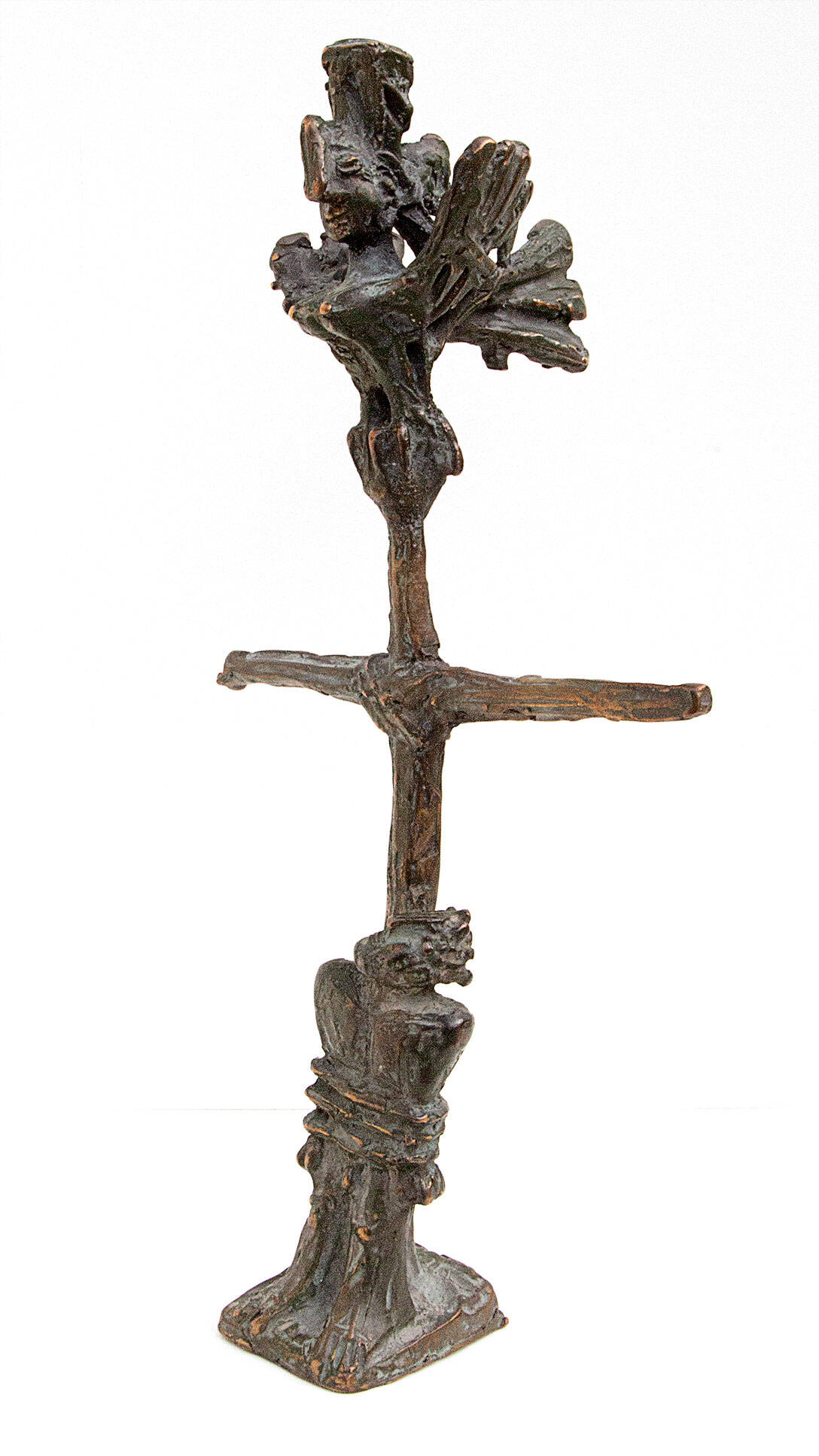 Bronze sculpture of a man tied to a pole with a creature on the top.